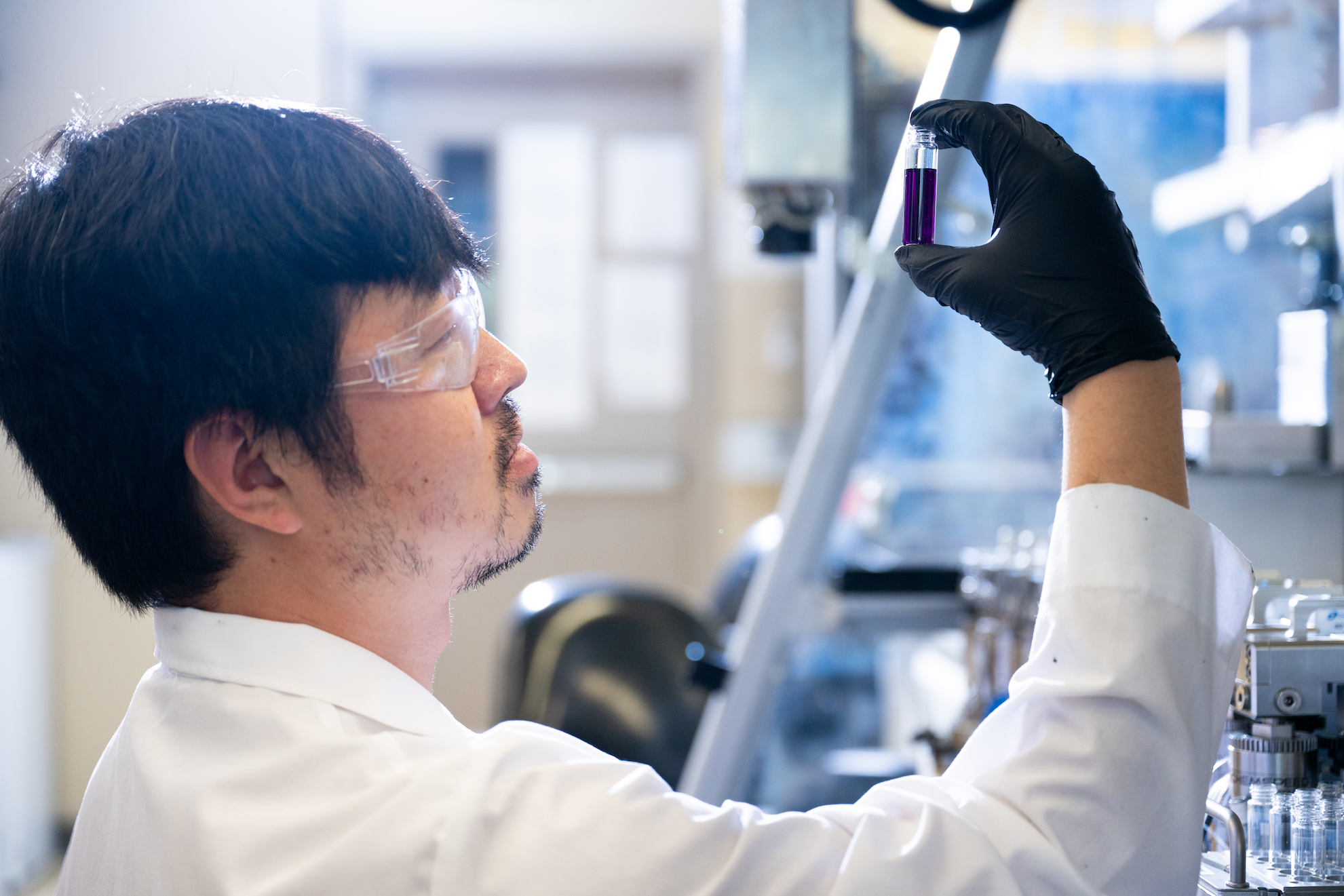 Photo of an NDSU student performing research in a lab