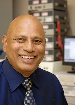 Jagdish Singh sitting at a computer
