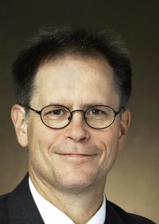 headshot of Joel Caton