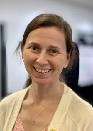 Jennifer smiling confidently at camera.