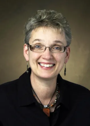 Susan Ray-Degges smiling confidently at the camera