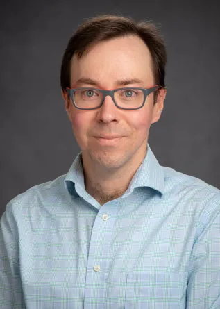 Ben Balas looking confidently at camera. 