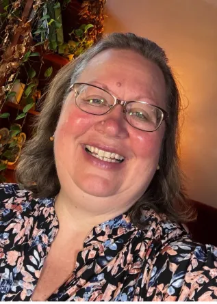 Krause smiling confidently at camera. 