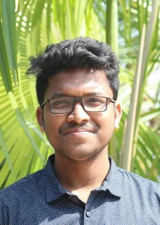 Fazle smiling at the camera.