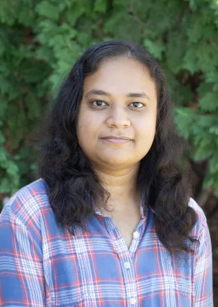 mahmuda smiling at the camera.