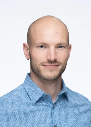 Jeremy smiling at the camera