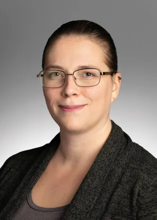 Dr. Strahm staring confidently at the camera