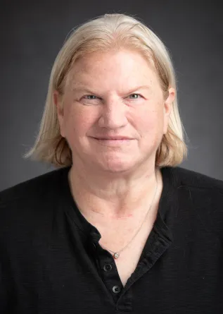 Tracy Barrett looking confidently at camera. 