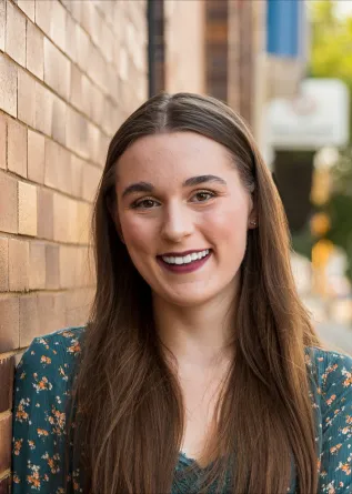 Alexandra Smith smiling confidently at camera. 