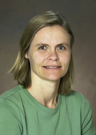 Angie smiling confidently at camera.