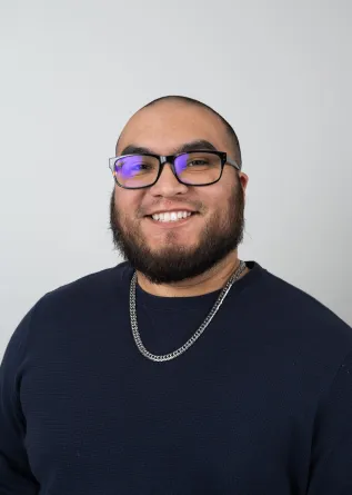 Carlos Roybal looking confidently into the camera.