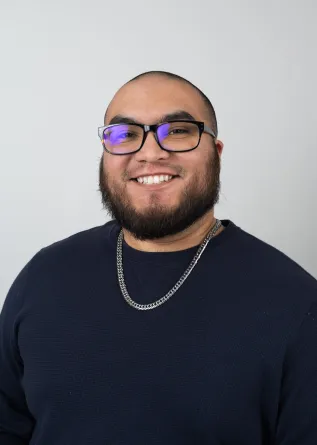 Carlos Roybal looking confidently into the camera.