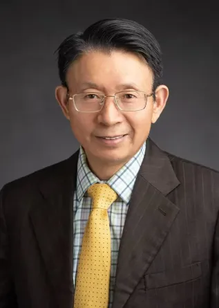 Dr. Yueh-Ting Lee confidently staring at the camera