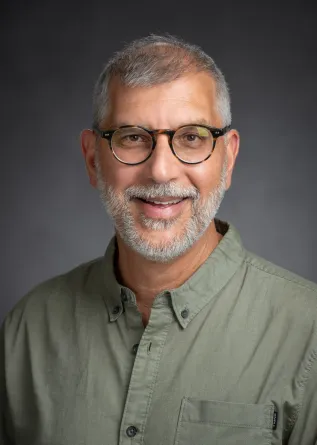 Professor Saini-Eidukat smiling confidently to the camera