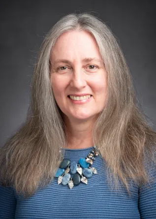 Laura Aldrich-Wolfe smiling confidently