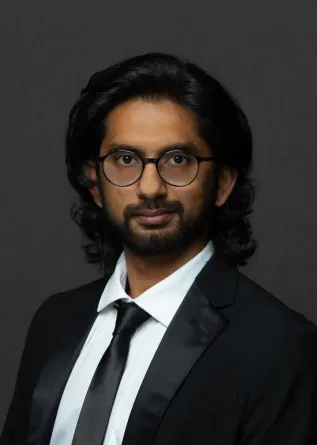 Atik Rahman looks pleasantly and confidently into the camera.