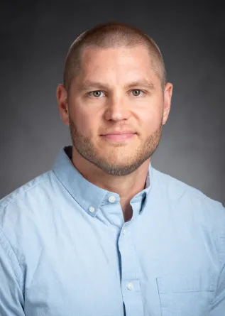 Dr. Nick Waters confidently staring at the camera