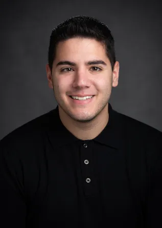 A young man smiling