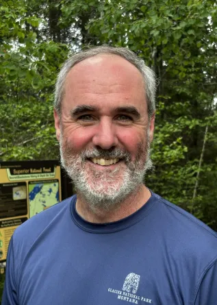 Tim Greives smiling confidently outdoors