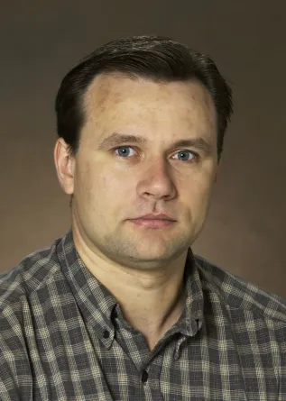 Andrei Kryjevski looking confidently at camera.