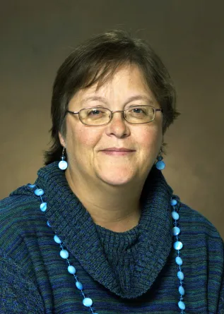 Smith smiling confidently at camera.