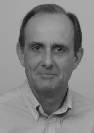 Stuart Croll confidently smiling into the camera.