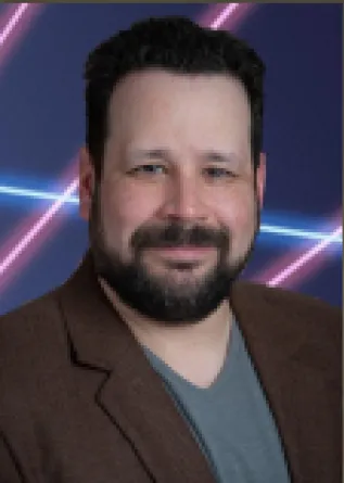 Giancarlo López-Martínez smiling confidently.