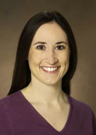 Katie Reindl smiling confidently.