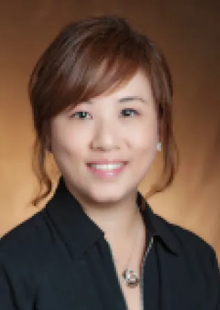 Jiha Kim smiling confidently.