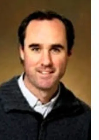 Timothy Greives smiling confidently.