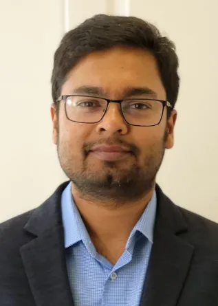 Bappaditya Chandra smiling confidently at the camera