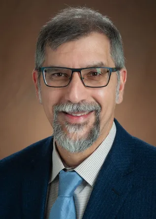 Bernhardt Saini-Eidukat smiling confidently at the camera