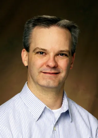 John Wilkinson smiling confidently at the camera