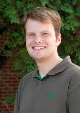 Matthew smiling at the camera