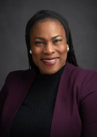 Bukola smiling at the camera