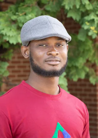 Samuel smiling at the camera