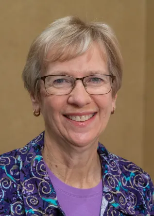 Becky Koch smiling confidently at camera. 