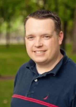 Jason smiling at the camera