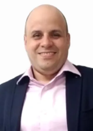 Gerardo Casanola smiling confidently into the camera.