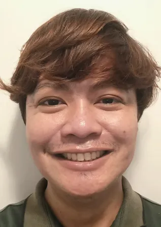 Reymark Maalihan smiling confidently into the camera.