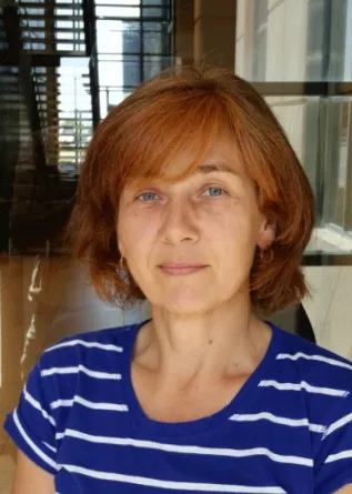 Olena Shafranska smiling confidently into the camera.