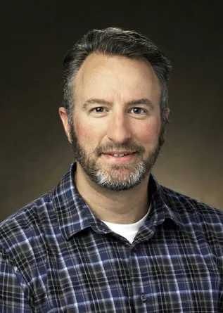 Ben Laabs smiling confidently at the camera. 