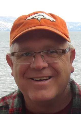 Craig smiling confidently at camera.