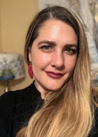 Natalie Smith Carlson smiling confidently at camera.