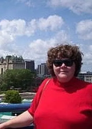 Kaye Temanson smiling confidently at camera.