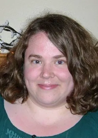 Cameron smiling confidently at camera.