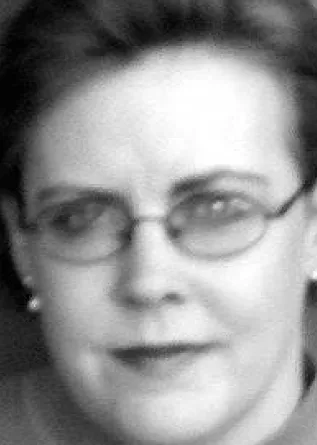 Julie Sandland smiling confidently at camera.