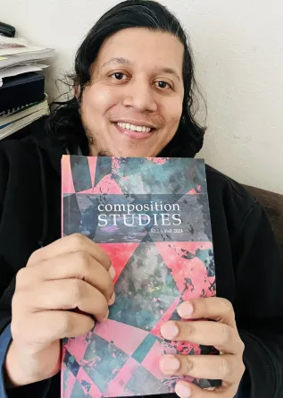 Nasih smiing at the cameral.