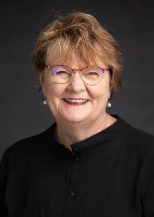 Mary smiling at the camera