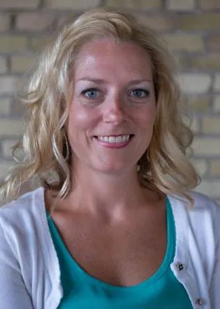 Heather Fischer smiling confidently at camera